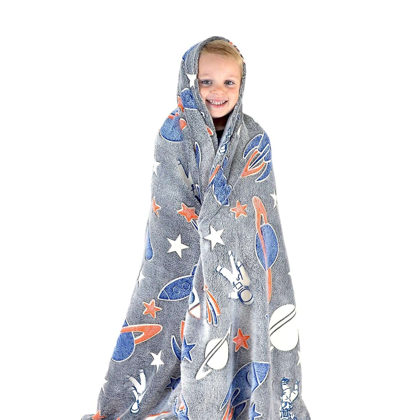 Child wrapped in a gray space-themed blanket with planets and stars from My Store