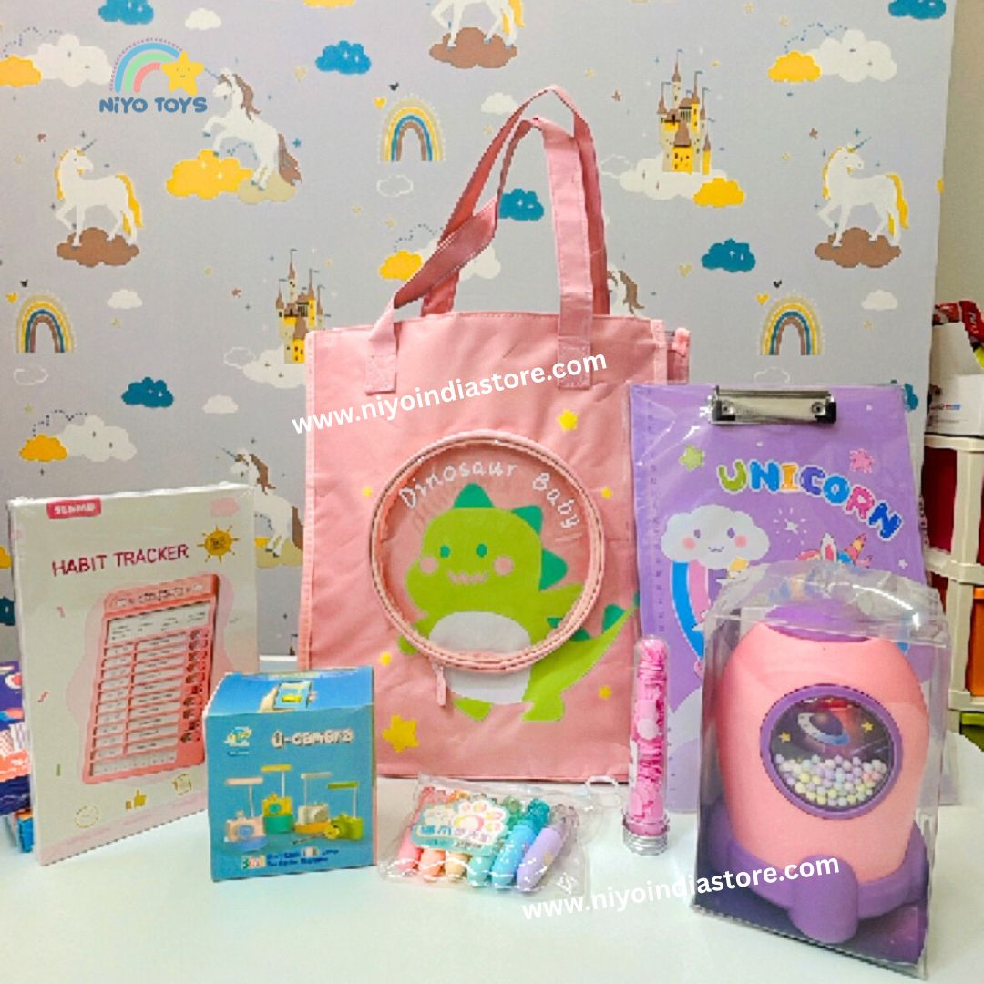 NIYO TOYS dinosaur baby hamper set with pink tote bag, unicorn clipboard, habit tracker, toys, and colorful chalks