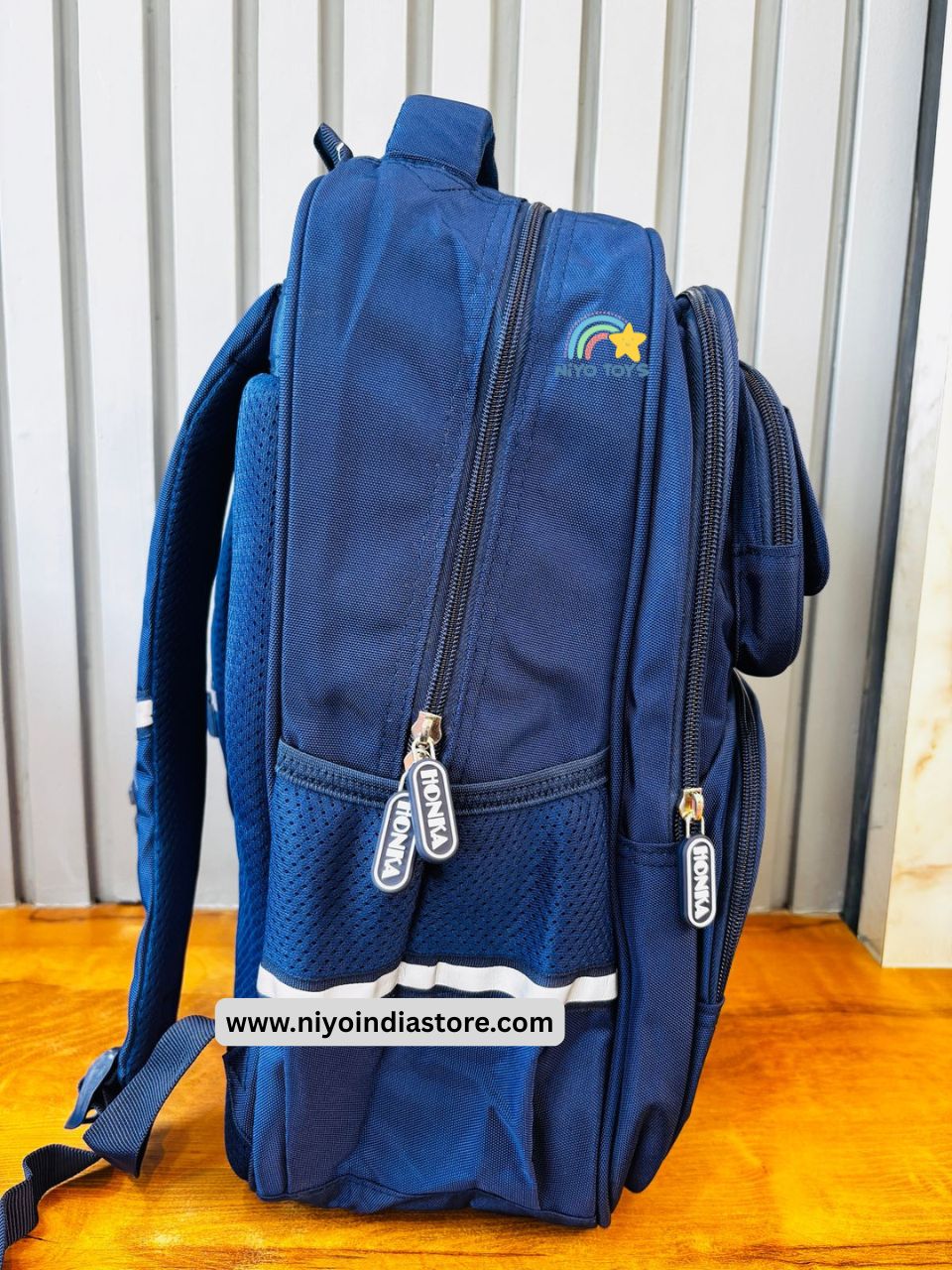 NIYO TOYS green and blue backpack 16 inch featuring multiple compartments and a stylish design