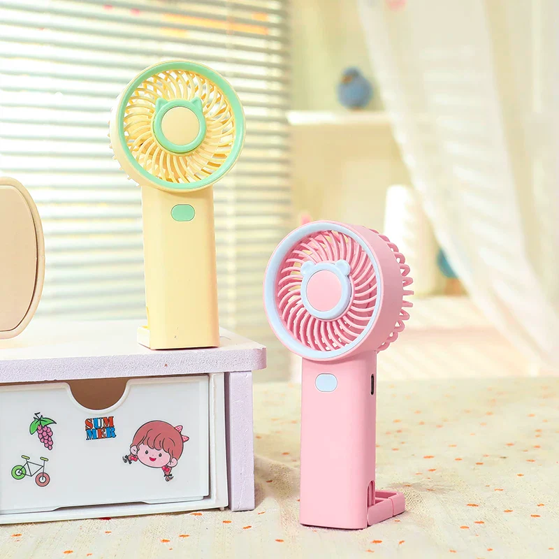 NIYO TOYS rechargeable fan in pastel yellow and pink, perfect for kids aged 3+ during summer adventures