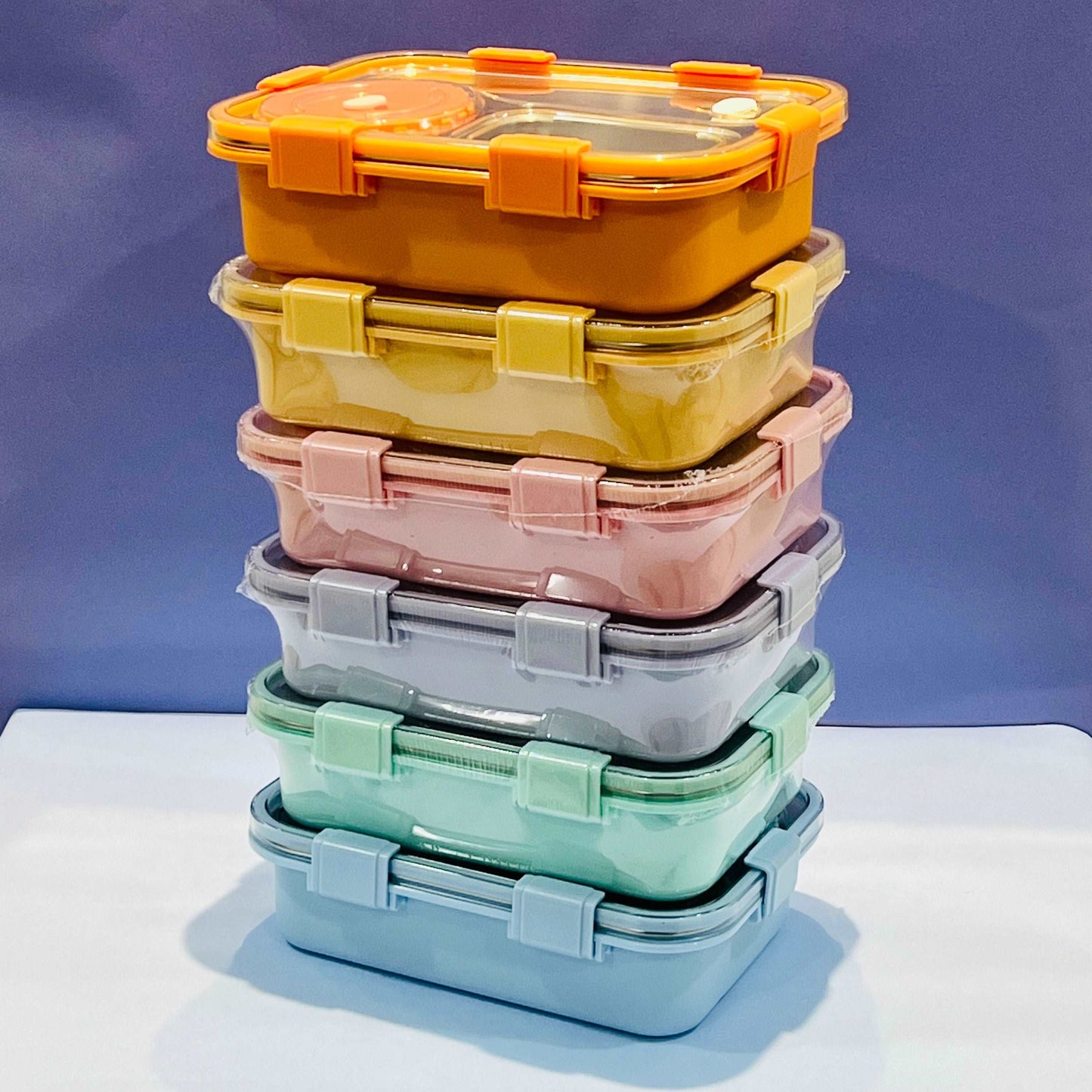 Colorful stack of NIYO TOYS Korean bento boxes for kids with secure lids for easy storage