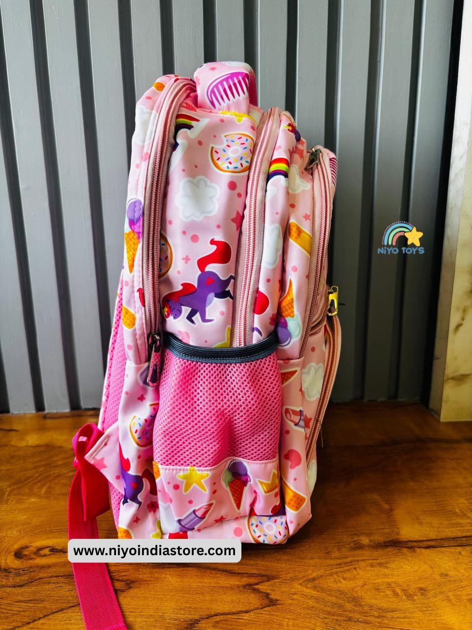 Pink Magical Unicorn School Bag with colorful designs and practical pockets for school essentials