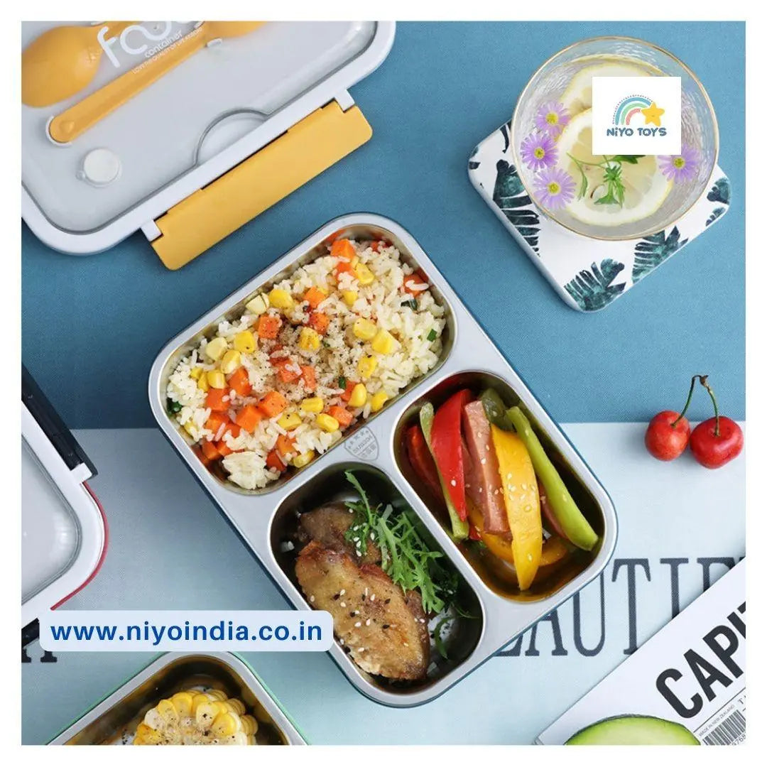 NIYO TOYS leakproof stainless steel lunch box with three compartments filled with rice, vegetables, and meat