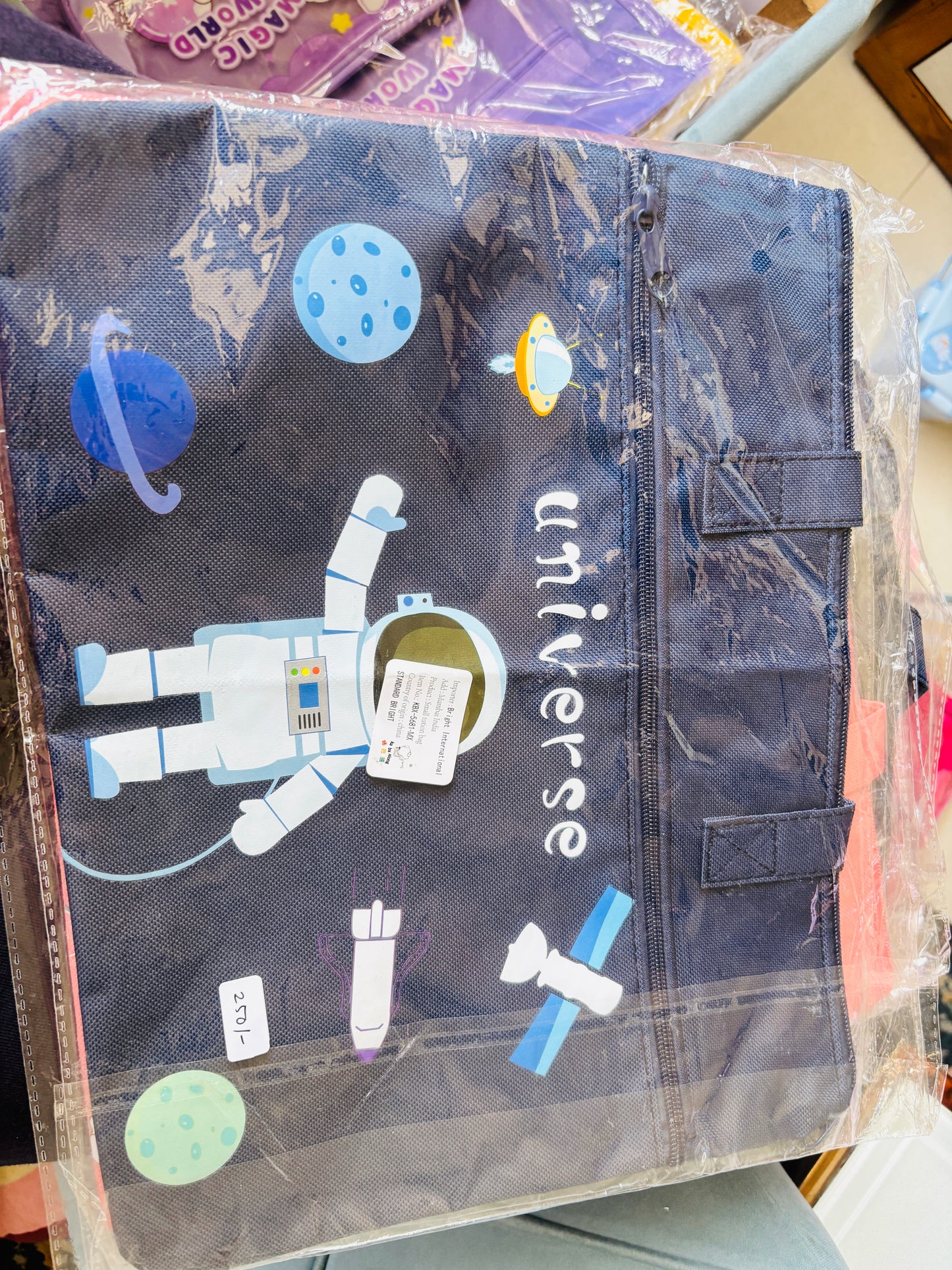 Niyo Tote Bag for Shopping featuring colorful astronaut and space designs on a navy background