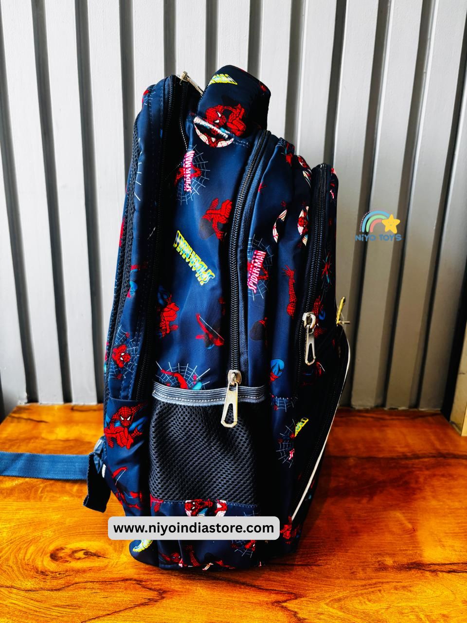 Spacious Spider-Man backpack for kids in navy blue featuring vibrant superhero designs