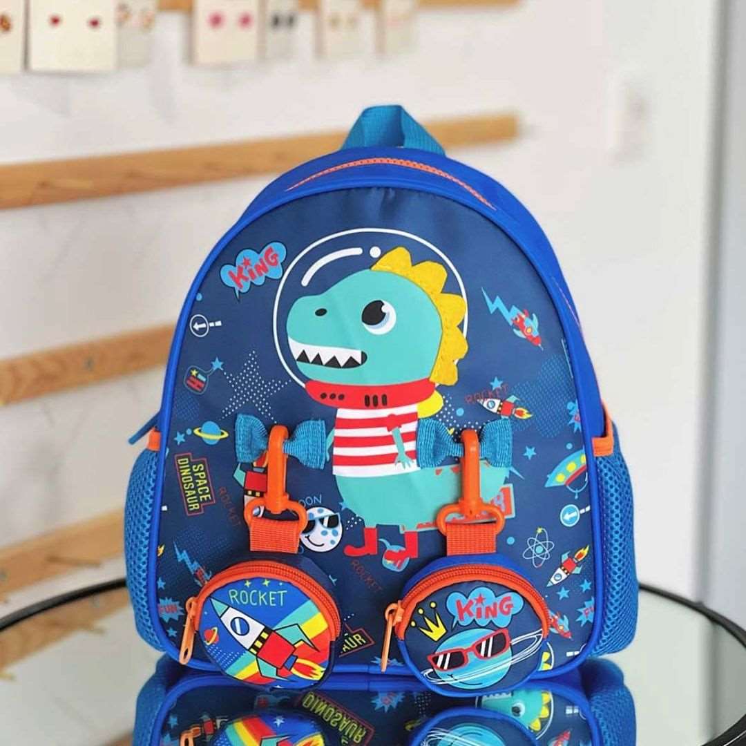 Colorful toddler backpack with pouches featuring a dinosaur design and playful accessories
