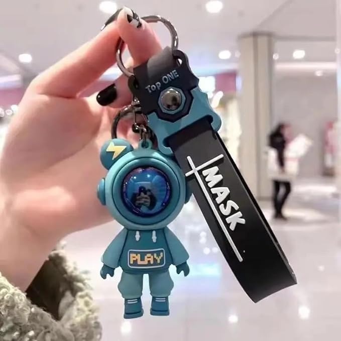 NIYO TOYS return gift keychain featuring a blue astronaut figure and black strap with mask text