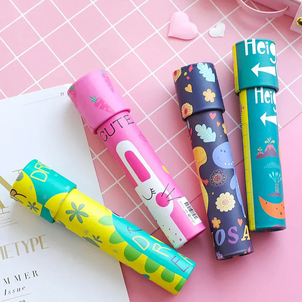 Colorful NIYO TOYS kaleidoscope toys with animal and floral designs on a pink grid background