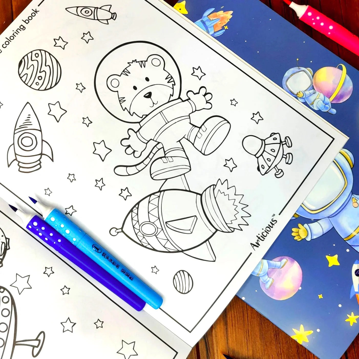 NIYO TOYS pencil colors set with blue and white pencils next to an astronaut-themed coloring book page
