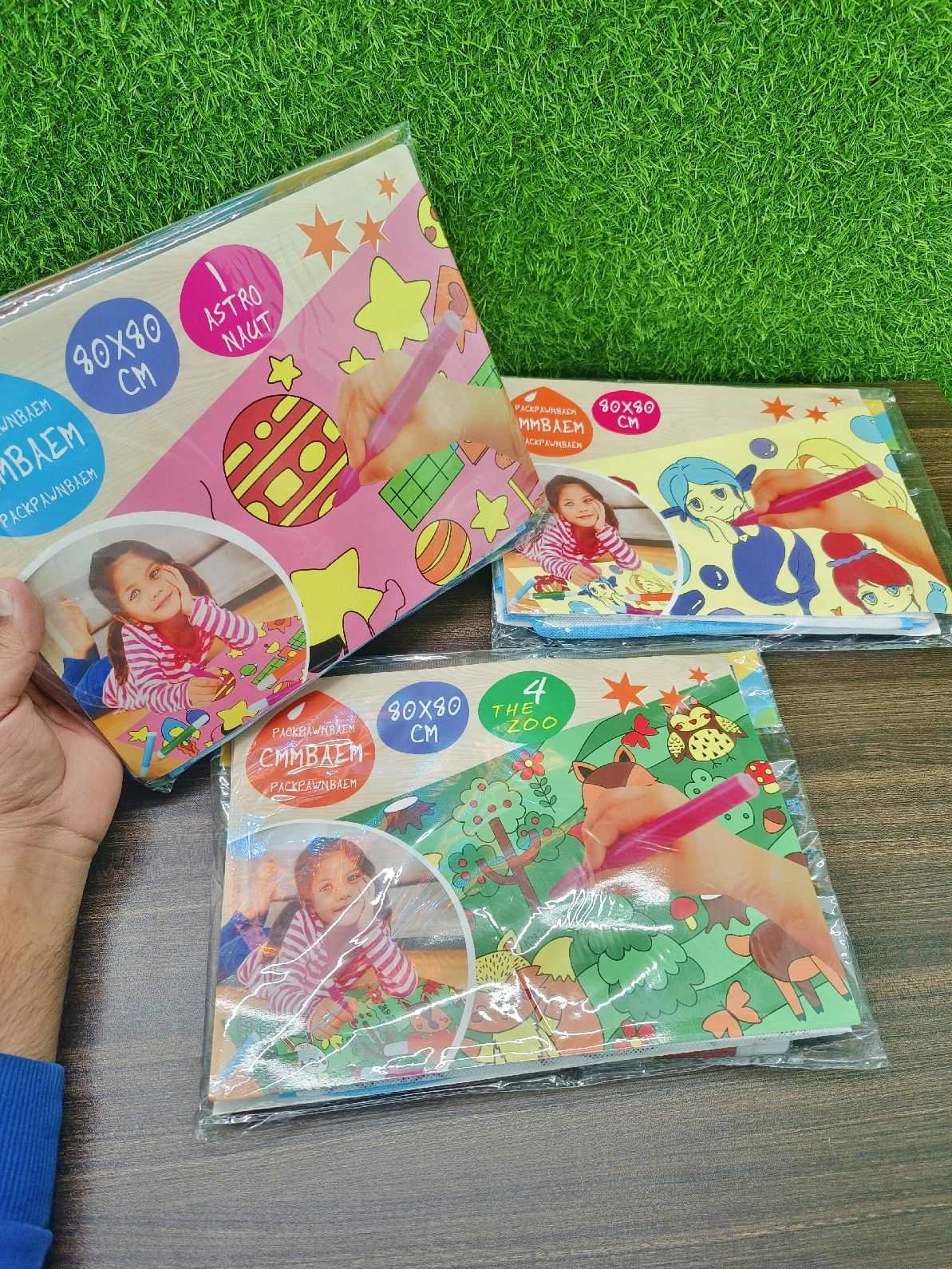 Set of three NIYO TOYS washable coloring mats for kids in vibrant designs, perfect for creative play