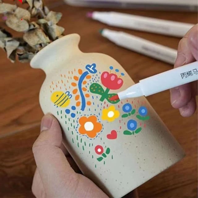 NIYO TOYS acrylic paint pens for crafts, bright colors applied on a vase for creative projects