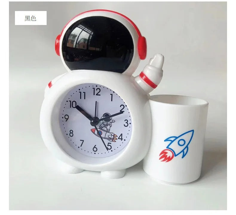 White astronaut alarm clock with cartoon rocket design, ideal for kids age 3+, perfect for bedtime routines