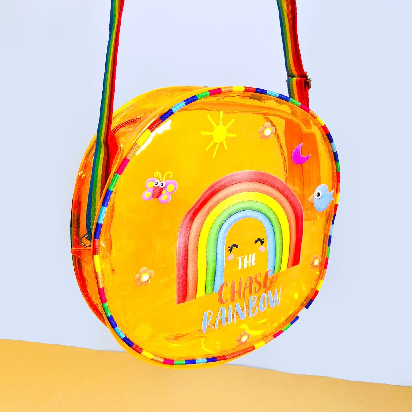 Bright yellow jelly bag with sling featuring rainbow design, suitable for kids age 5+, perfect for outings