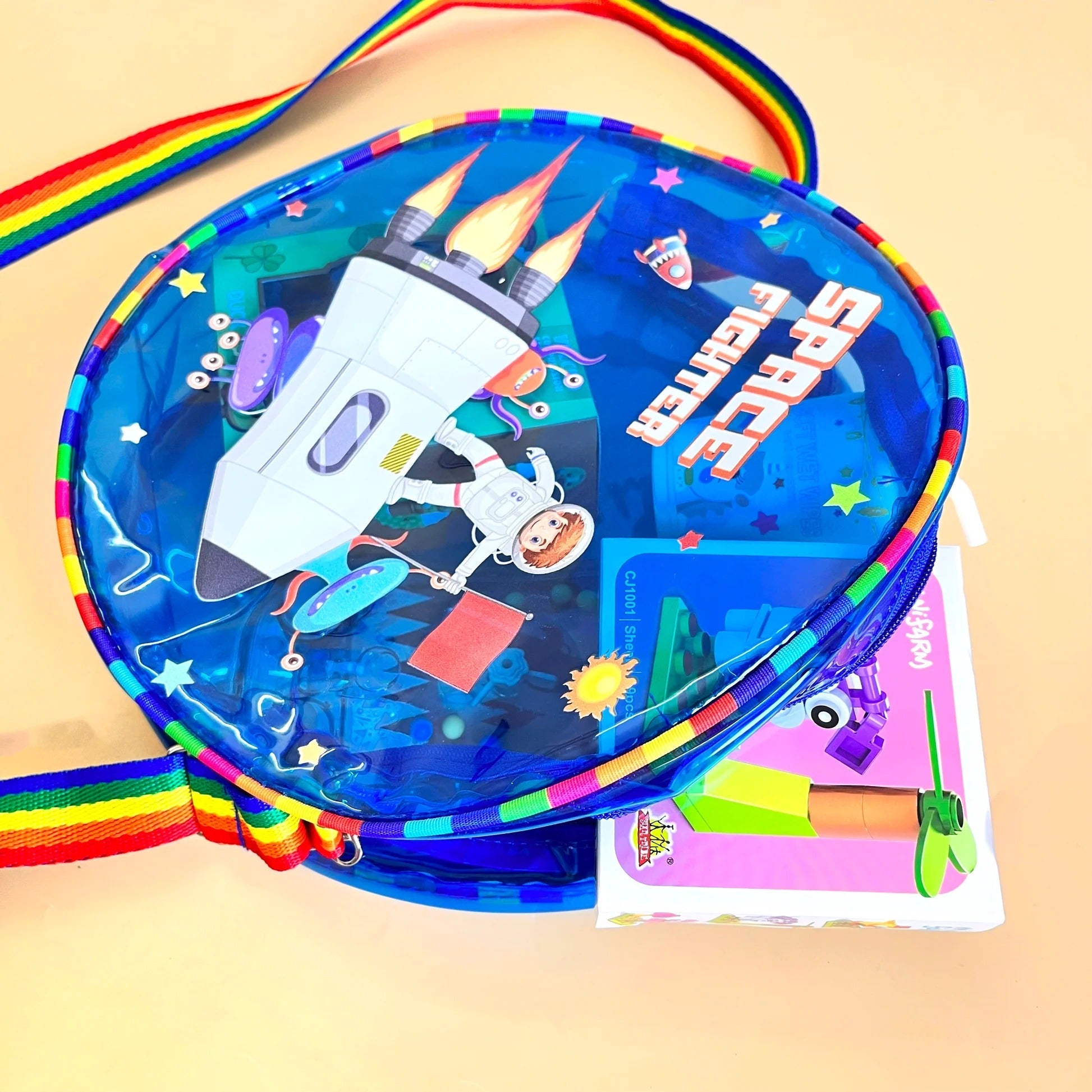 Colorful NIYO TOYS jelly bag with sling, featuring space fighter design for kids age 3+, perfect for toys and accessories