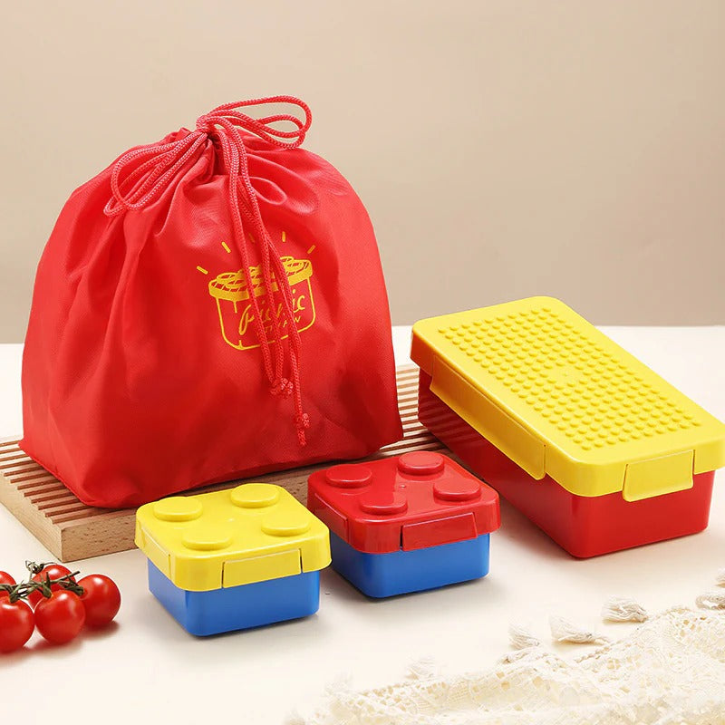 Red and yellow building blocks lunch box for kids, age 3+, ideal for school lunches and snacks