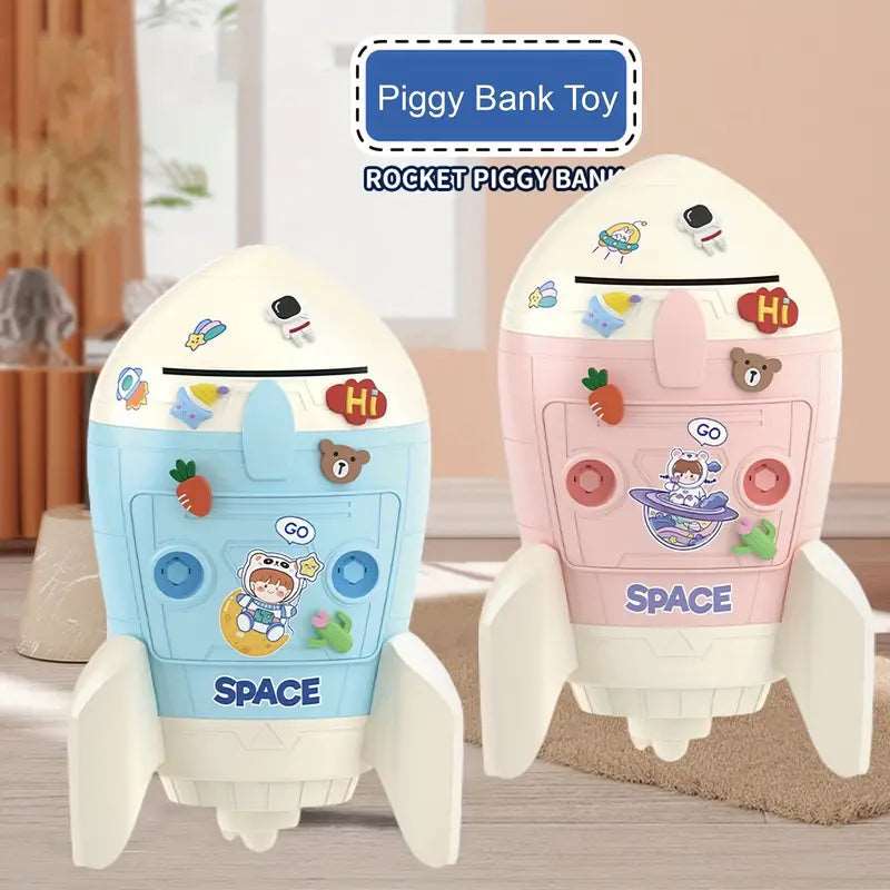 Cardboard spaceship DIY piggy bank in blue and pink, designed for kids age 3+, perfect for saving coins