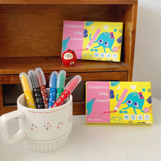Children's silky crayons in six vibrant colors, designed for ages 3 and up, perfect for creative play