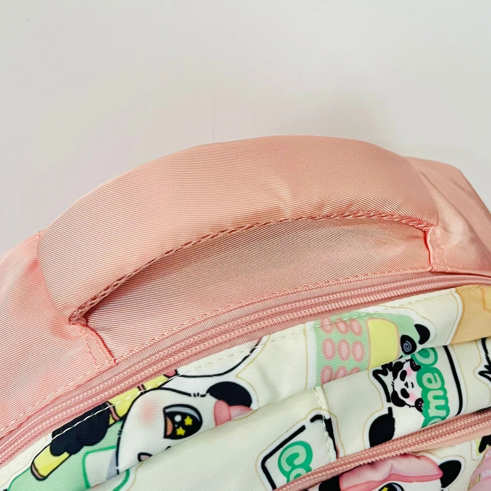 Pink NIYO TOYS panda backpack with colorful design, perfect for kids age 3 and up