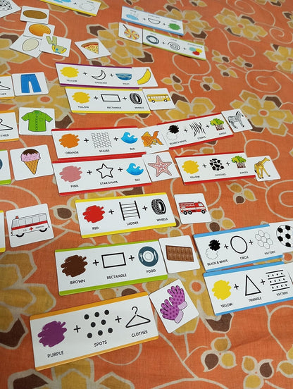 NIYO TOYS educational color and shape matching puzzle cards laid out on a patterned orange surface
