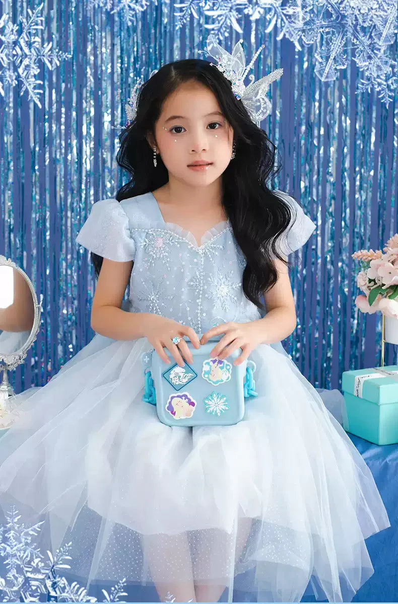 Light blue NIYO TOYS sling bag designed as a coach purse shoulder bag for kids age 3 and up