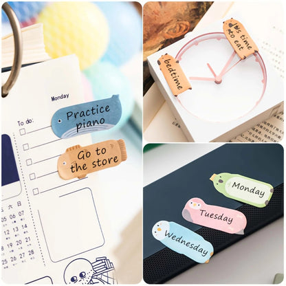 Colorful decorative sticky notes post it in fish shapes for organizing tasks and reminders
