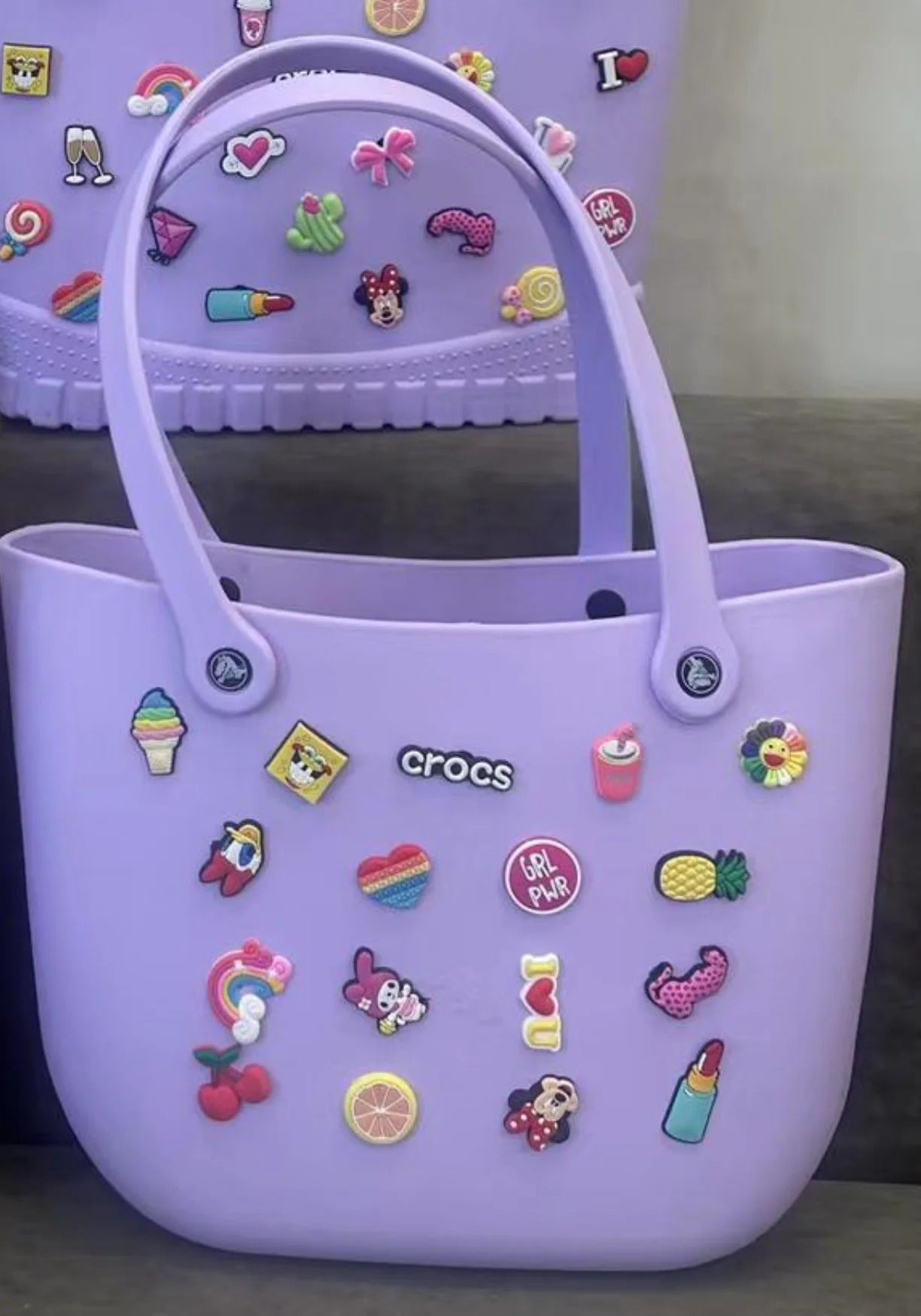Purple Crocs tote bag with colorful charms for kids, ideal for daily use and outings
