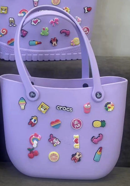 Purple Crocs tote bag with colorful charms for kids, ideal for daily use and outings