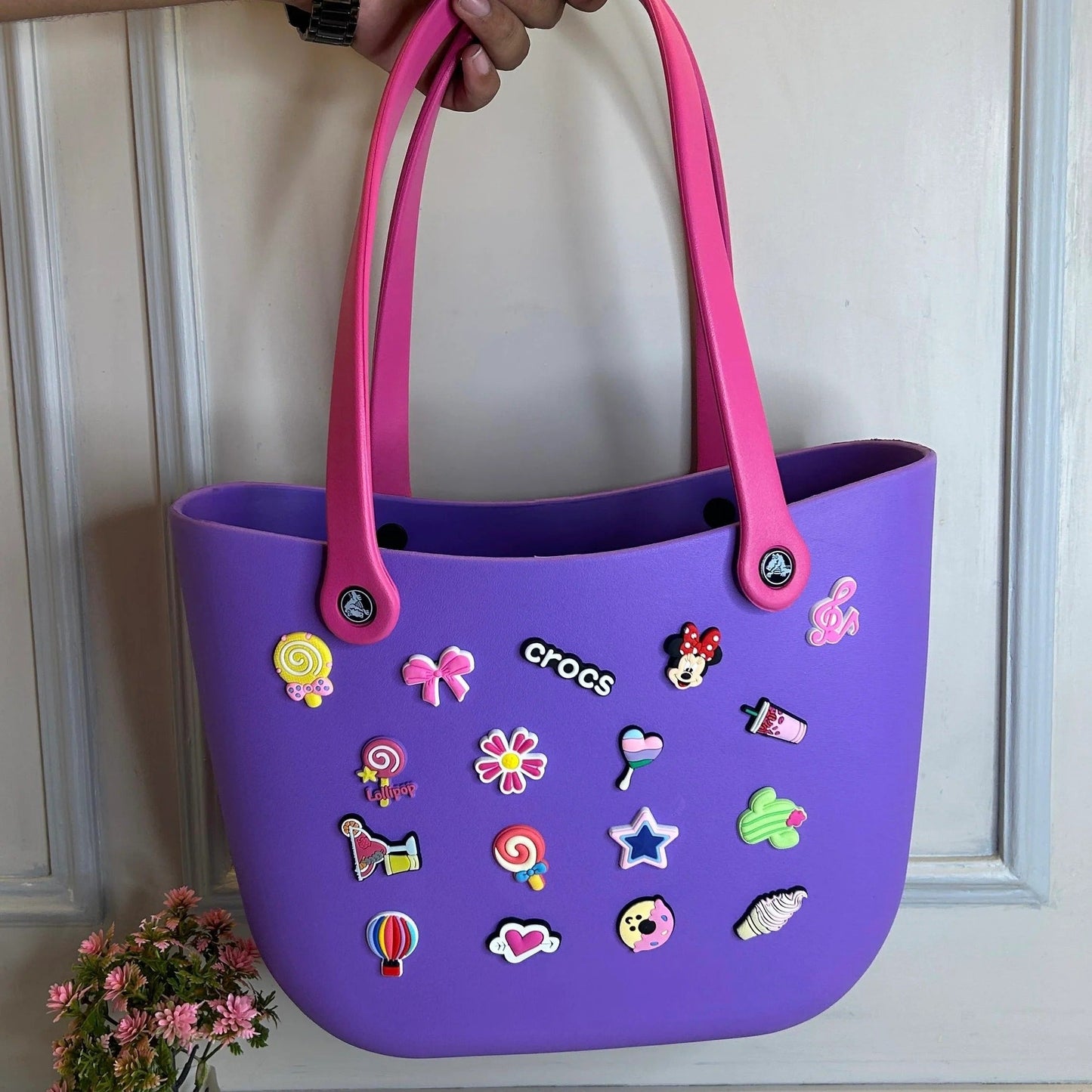 Purple NIYO TOYS tote bag decorated with colorful crocs charms, suitable for kids age 3 and up