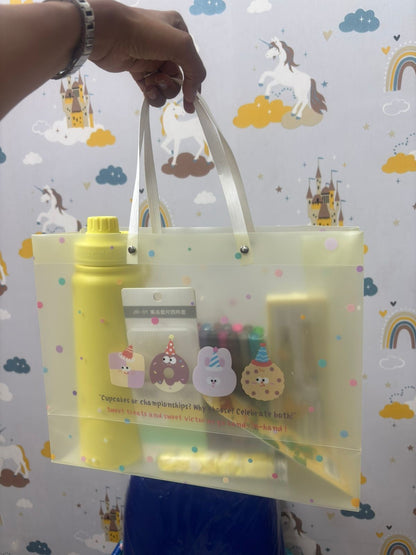 Transparent yellow NIYO TOYS hamper with custom stationery set, ideal for kids and organization