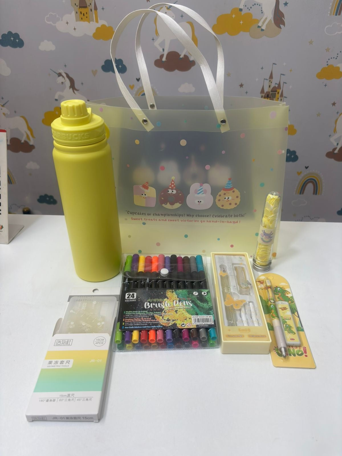 Translucent yellow hamper containing a custom stationery set, ideal for kids aged 5 and up.