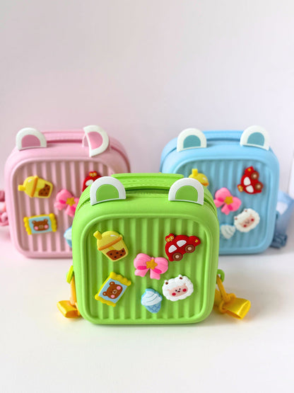 Cute kids backpack in green with fun food-themed decorations for ages 3 and up