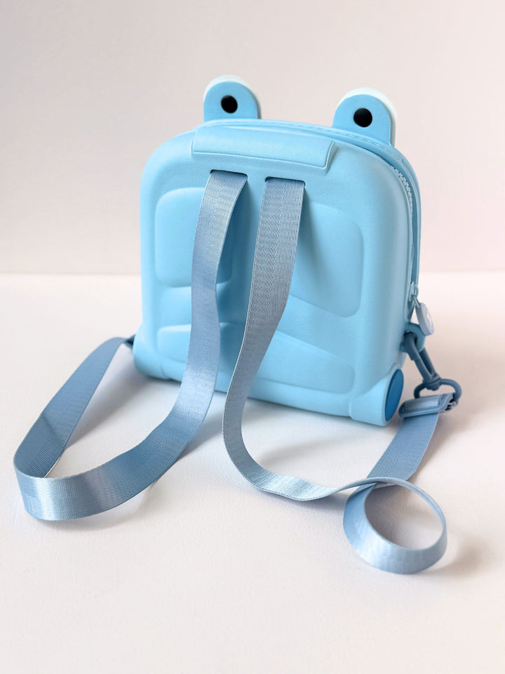 Cute kids backpack in light blue, designed for ages 3+ with fun frog eyes and adjustable straps