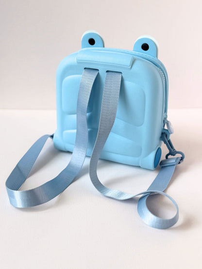 Cute kids backpack in light blue, designed for ages 3+ with fun frog eyes and adjustable straps