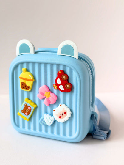 Cute kids backpack in light blue with fun 3D decorations, perfect for ages 3 and up