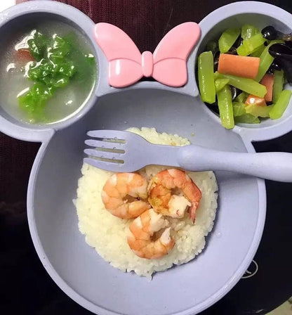 Purple eco-friendly dinnerware set with compartments for toddlers, featuring a bow design and a fork