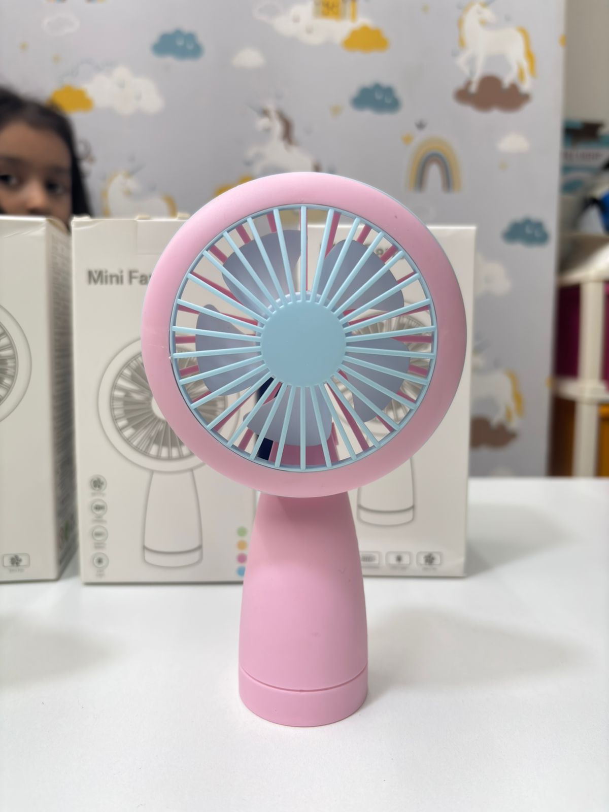 NIYO TOYS pink mini fan designed for kids, perfect for warm days and portable use