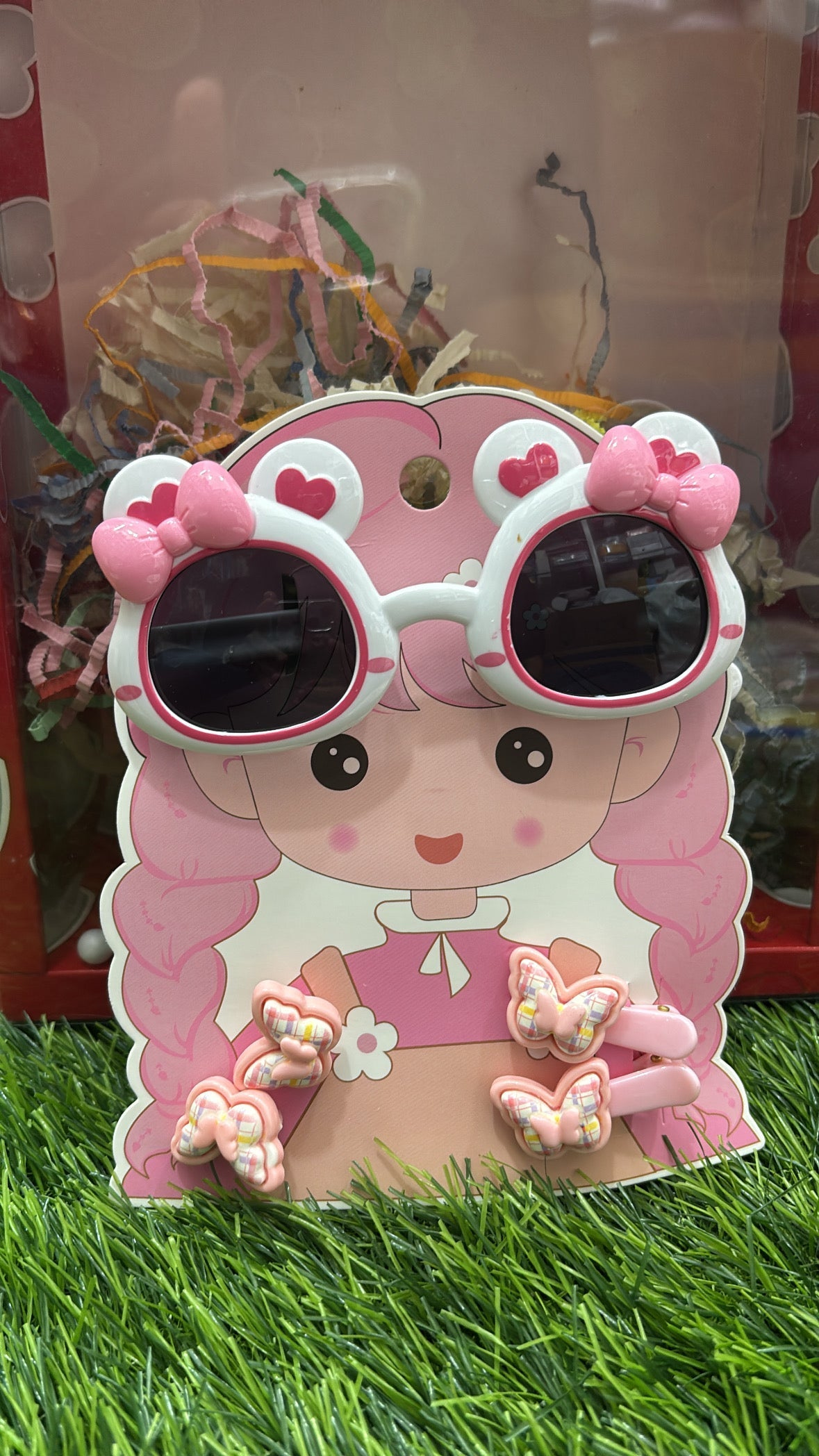 Pink heart-shaped sunglasses for kids with butterfly clips, ideal for stylish sun protection