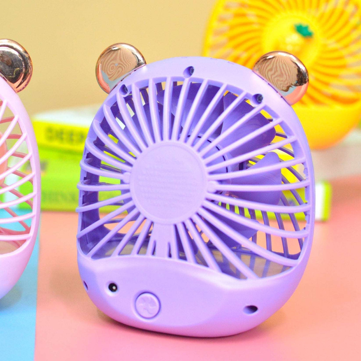 Purple bear-themed hand held fan for kids, perfect for staying cool on hot days