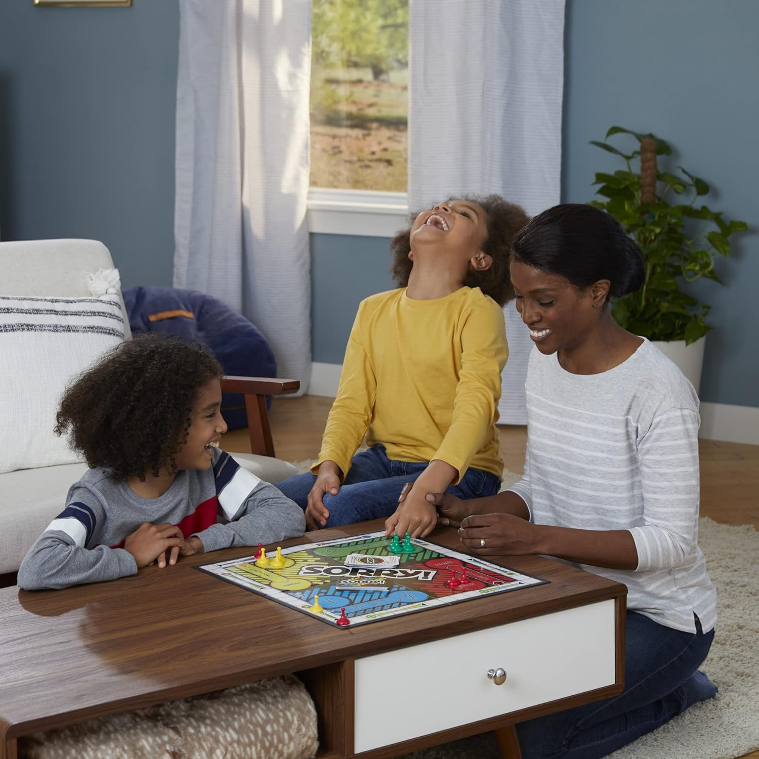 Family playing a colorful board game games together, perfect for ages 6 and up, promoting fun and bonding