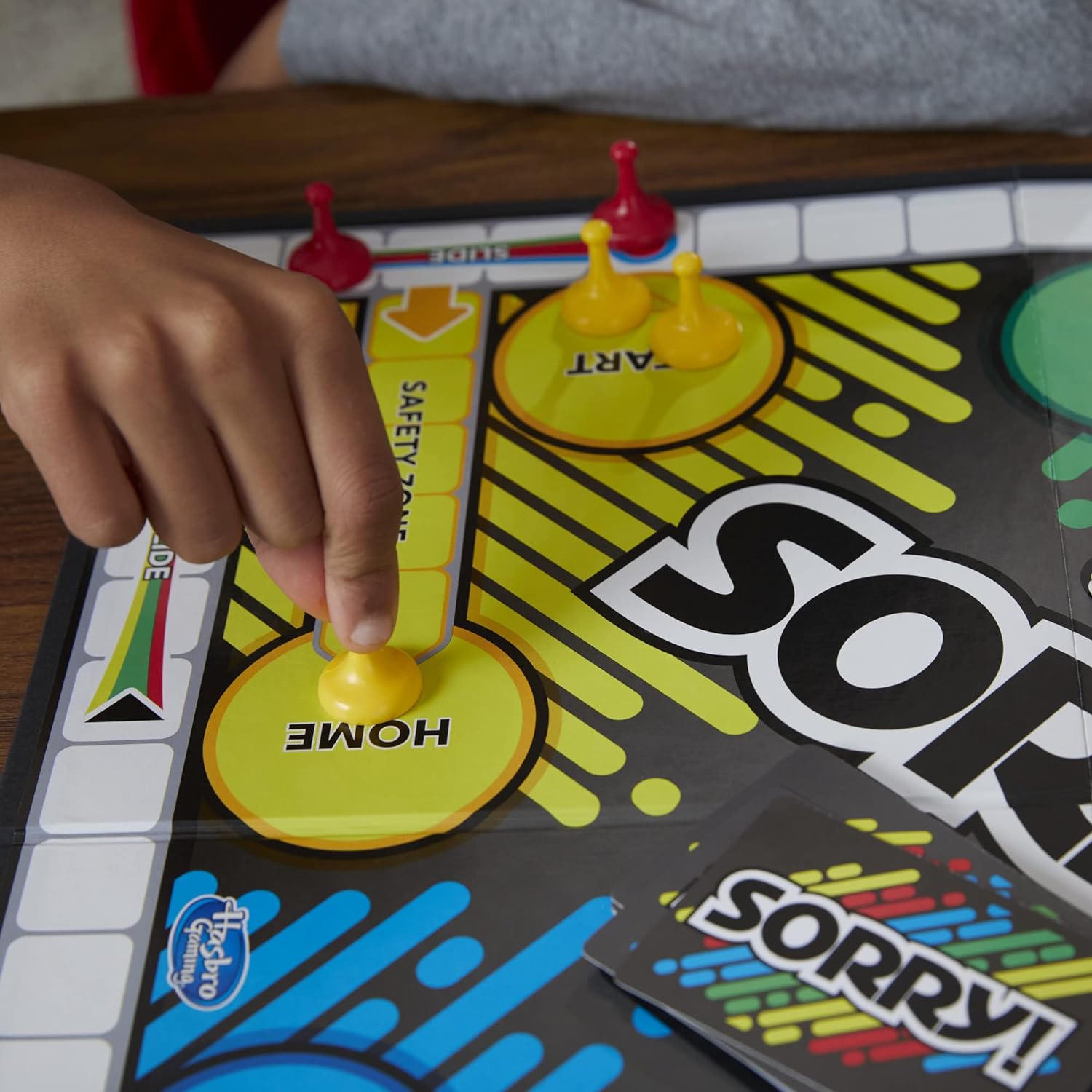 Colorful Sorry! board game with yellow and red player pieces, age 6+, fun family game night