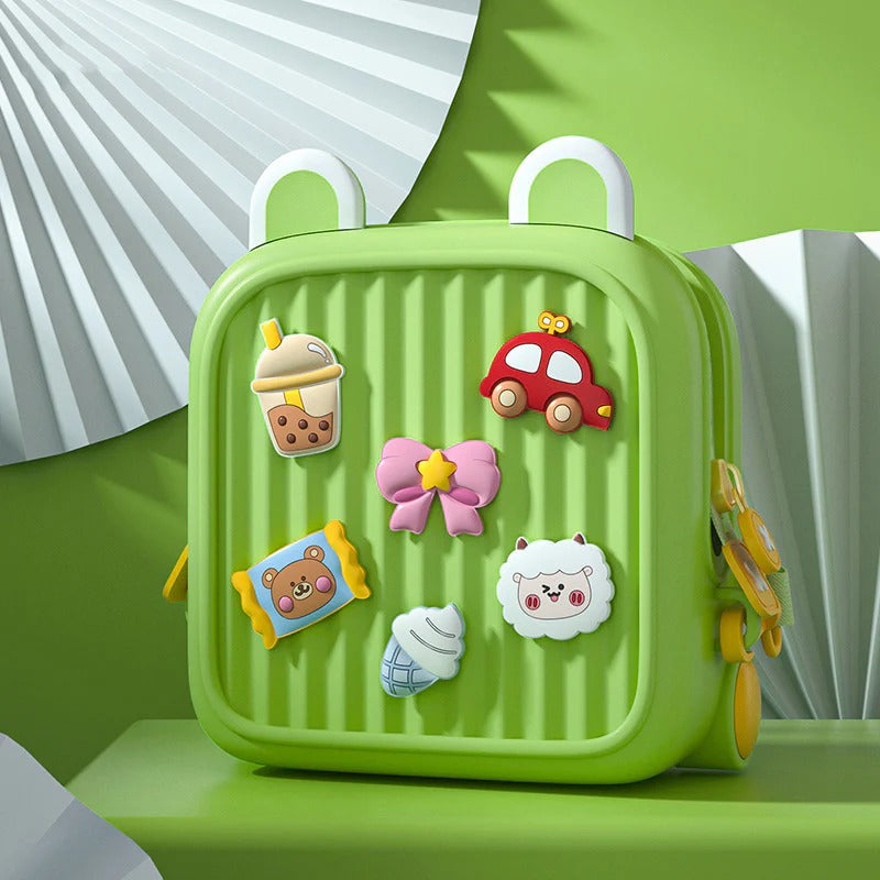Cute kids mini backpack in green with colorful charms and playful design for young children