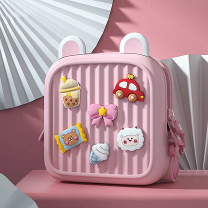 Cute kids mini backpack in pink with colorful patches and ear details for fun and playful style