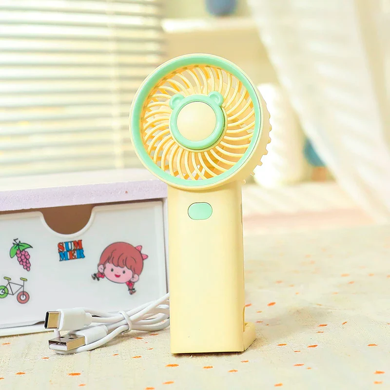 NIYO TOYS rechargeable fan in yellow and green, portable design for kids and adults