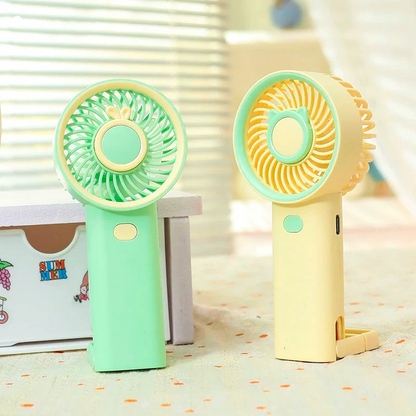 Rechargeable fan in mint green and pastel yellow, perfect for kids and adults in hot weather