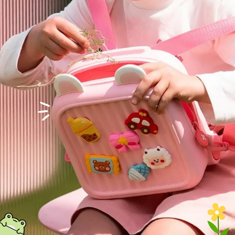 Cute kids mini backpack with colorful patches, perfect for young children's daily adventures
