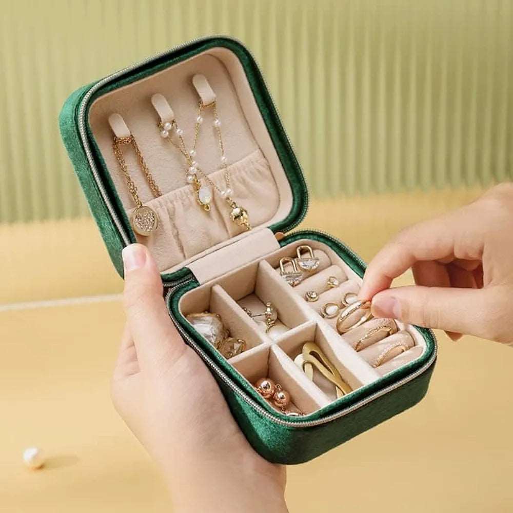 Green jewelry case for travel with organized compartments for rings and earrings, perfect for age 12 and up