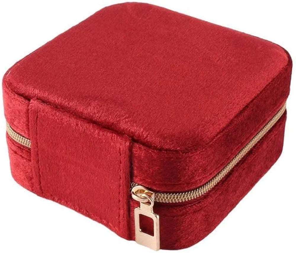 Red velvet jewelry case for travel with secure zipper, perfect for organizing accessories