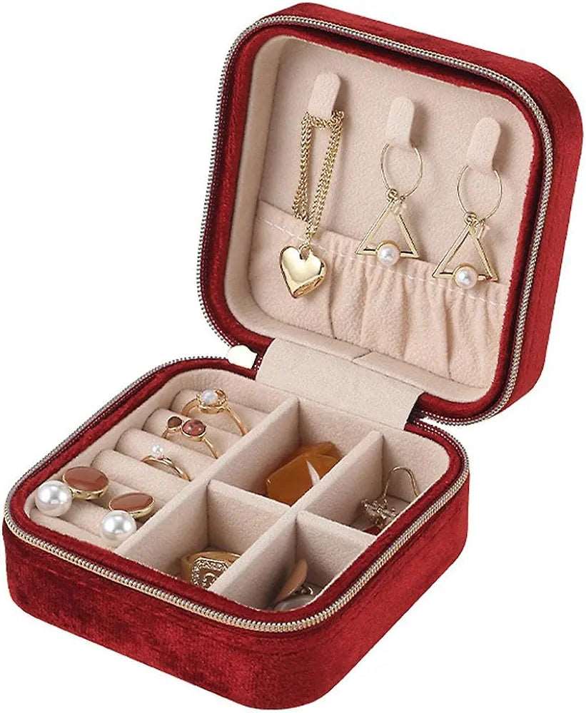 Red velvet jewelry case for travel with multiple compartments for organizing earrings and rings