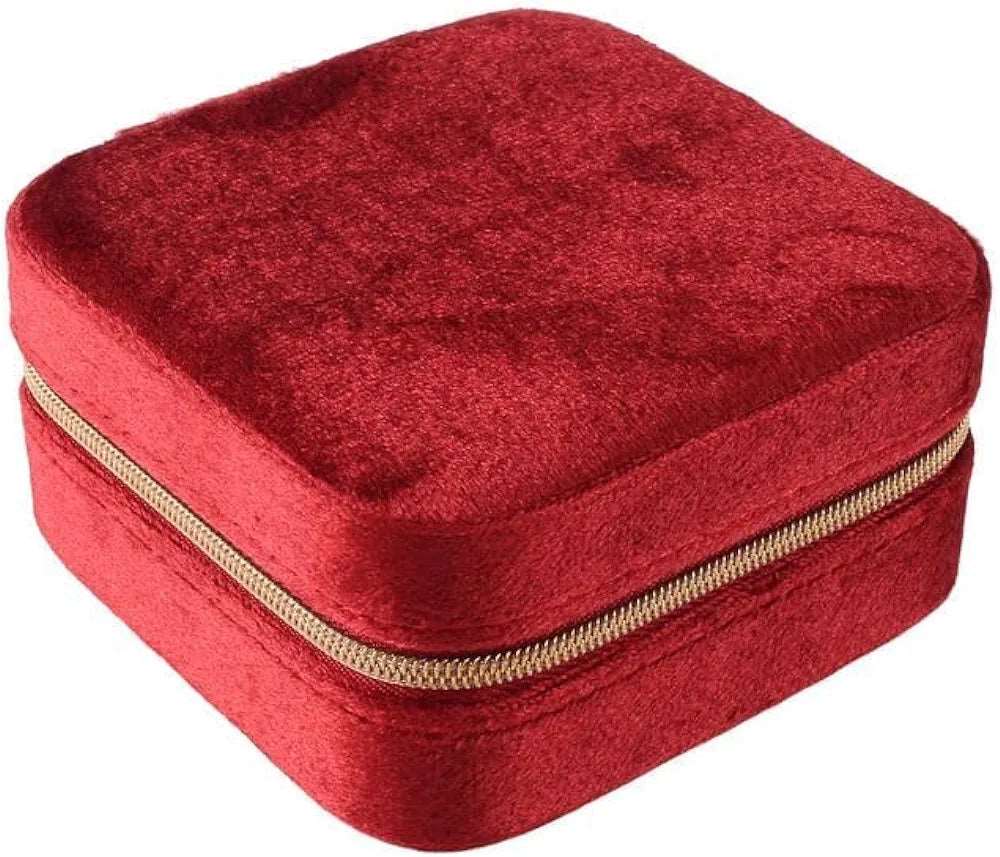 Red velvet jewelry case for travel, ideal for safely storing accessories on the go