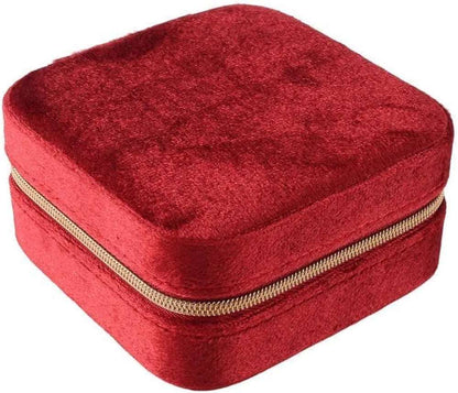 Red velvet jewelry case for travel, ideal for safely storing accessories on the go